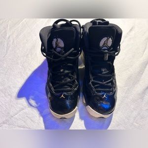 Boys Jordan Sized 7 Black, Gold, and White Shoes .
